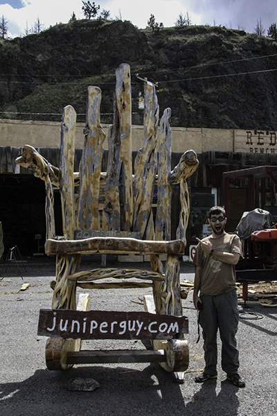 Caleb next to a giant chair