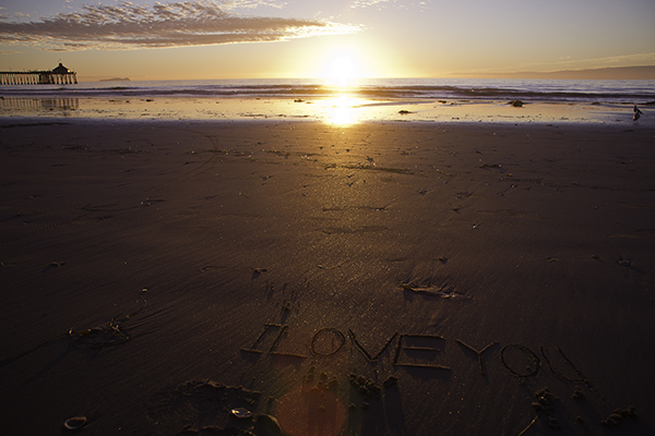 carving love in the sand
