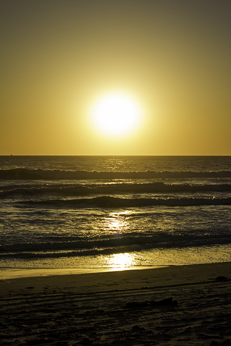 the glowing sun and a ship on the left