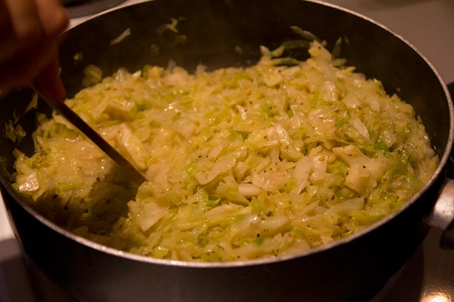 Grama stirring the cabbage noodles