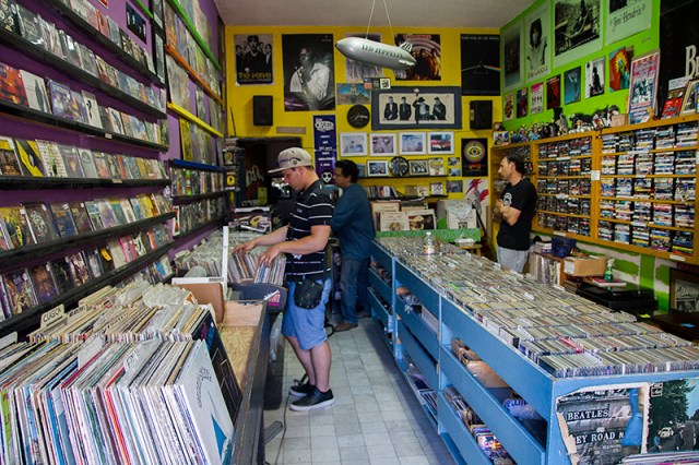 Jonas looking at vinyl records