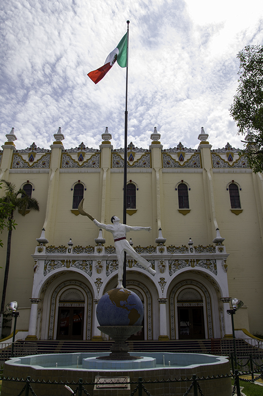 Jai Alai Fronton Palace with statue of the Pelotari in front