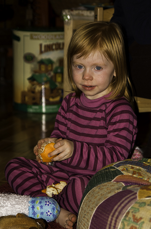 Emma eating a mandarin