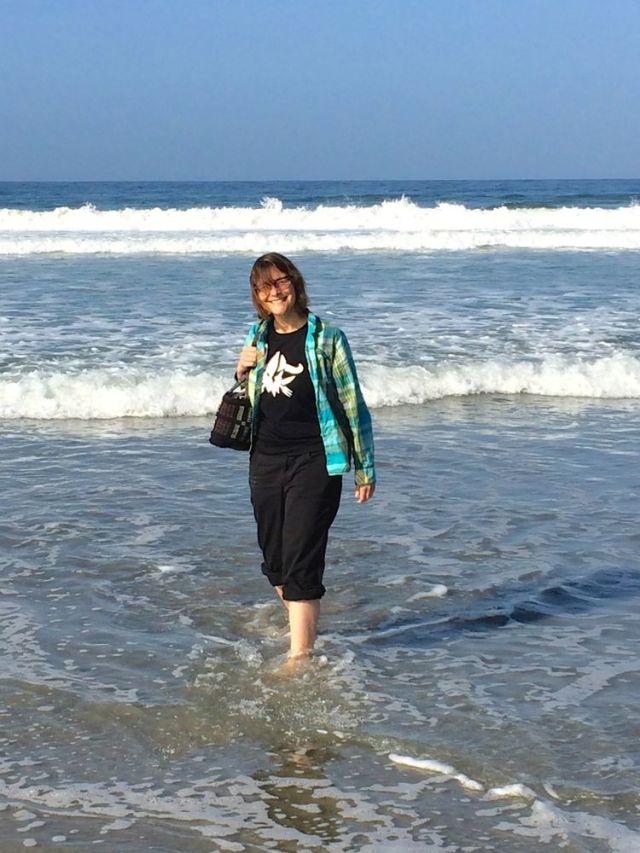 ... standing with her toes in the sand