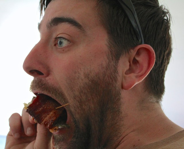 Caleb eating bacon