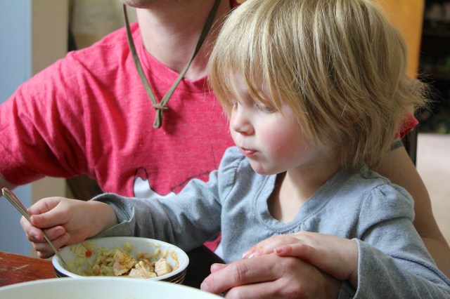 Lyra sharing chicken and pilaf with Jake