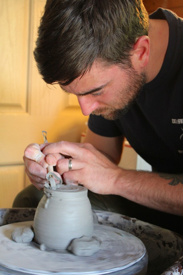 Caleb scraping his cup