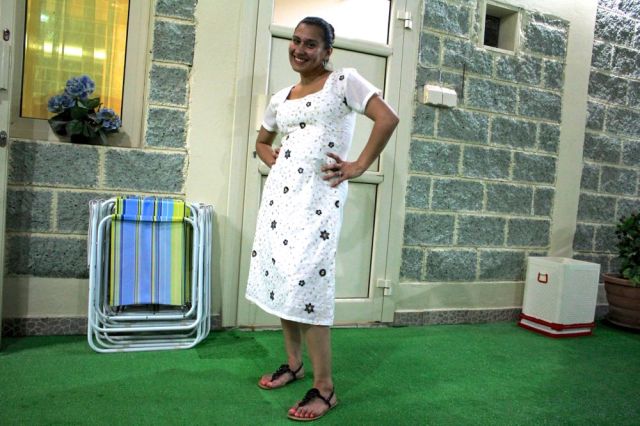 Christie posing in her dress made at the Souq