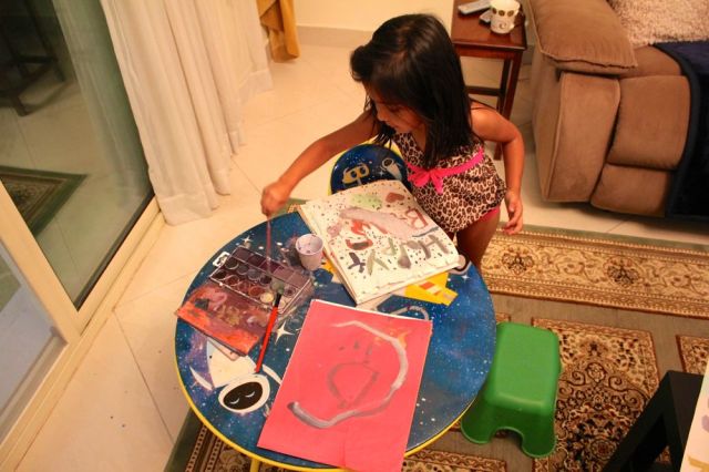 Angel showing me her watercolors - all the purple and gray ones