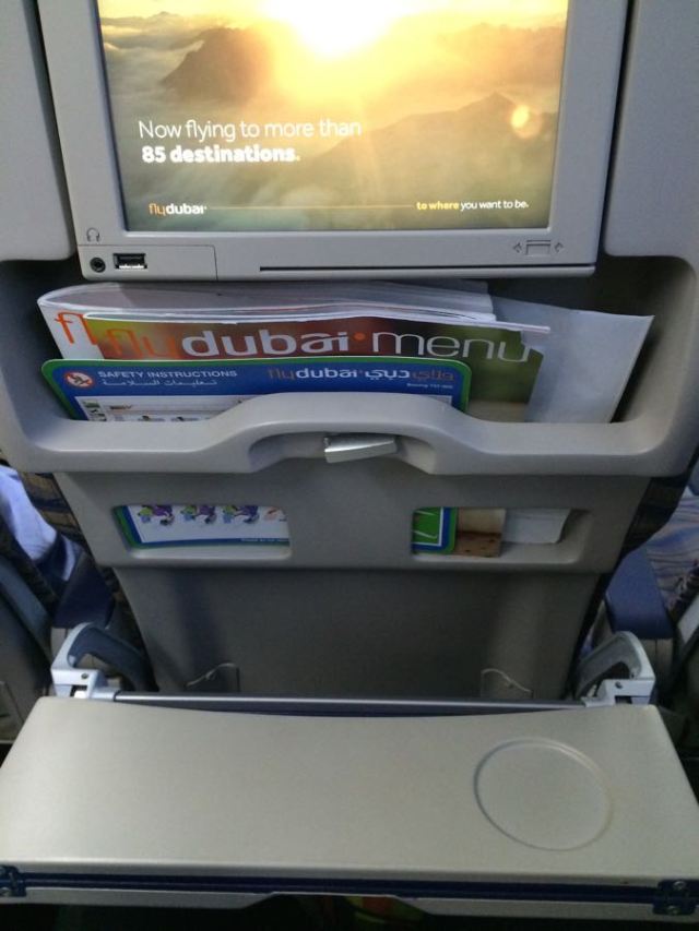 a menu (no free water or snacks) and a folding tray - less leg room and more tummy space