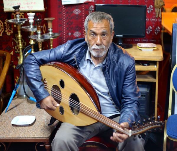 old man with his oud