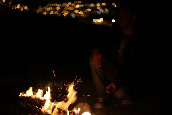 city lights while fireside