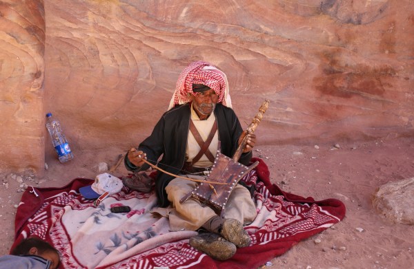 man playing a fiddle-like instrument