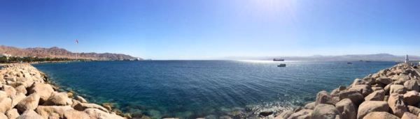 panorama of Aqaba beach with Saudi, Egypt, and Israel in the distance